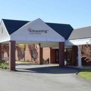 The exterior of a building with an entrance featuring an awning.