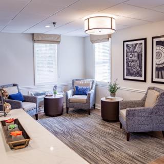 A cozy and modern living room with comfortable seating and elegant decor.