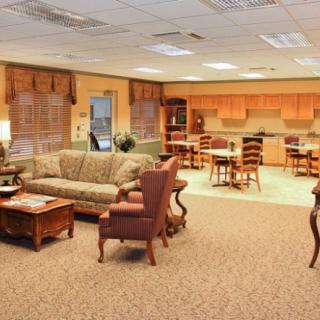 A spacious living room with comfortable seating and a connected dining area.