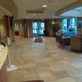 A spacious lobby featuring comfortable seating and natural light.