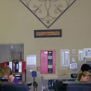 Employees working at desks in an office environment.
