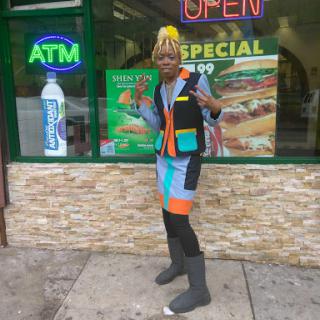 A vibrant fashion statement in front of a local store.