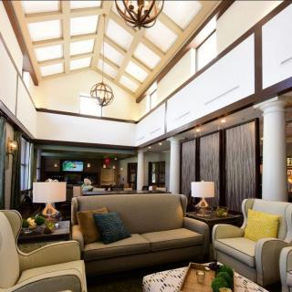 A spacious living room with elegant furnishings and abundant natural light.