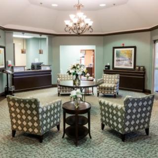 Elegant lobby area with comfortable seating and chandelier lighting.