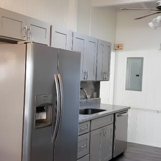 A modern kitchen with stainless steel appliances and sleek cabinetry.