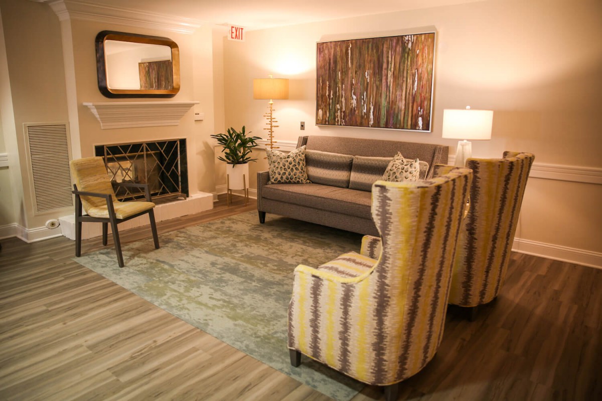 A cozy living room with modern furniture and warm lighting.