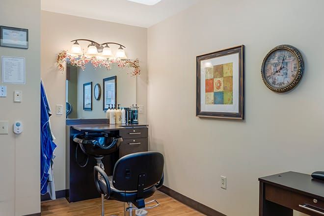 A well-organized hair salon station with stylish decor and warm lighting.