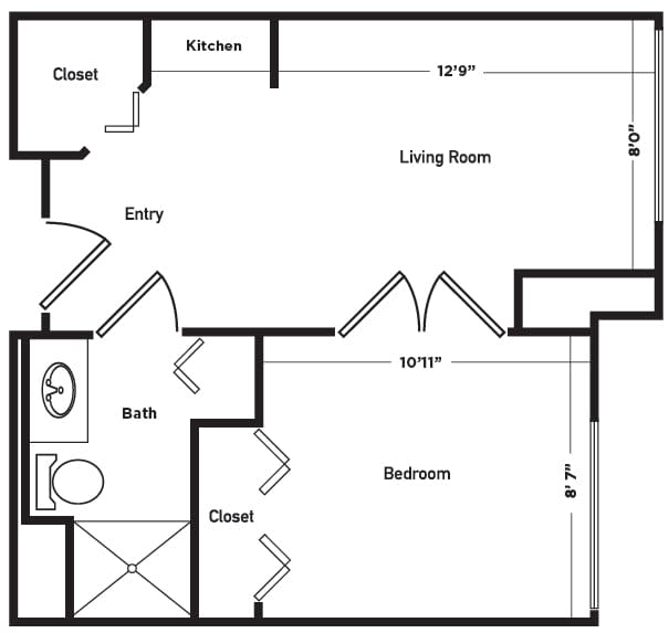 A floor plan of a one-bedroom apartment with labeled areas for the kitchen, living room, bedroom, bath, and closets.