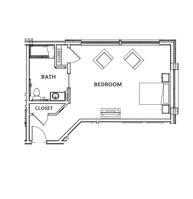 A simple floor plan showing a bedroom with an attached bathroom and closet.