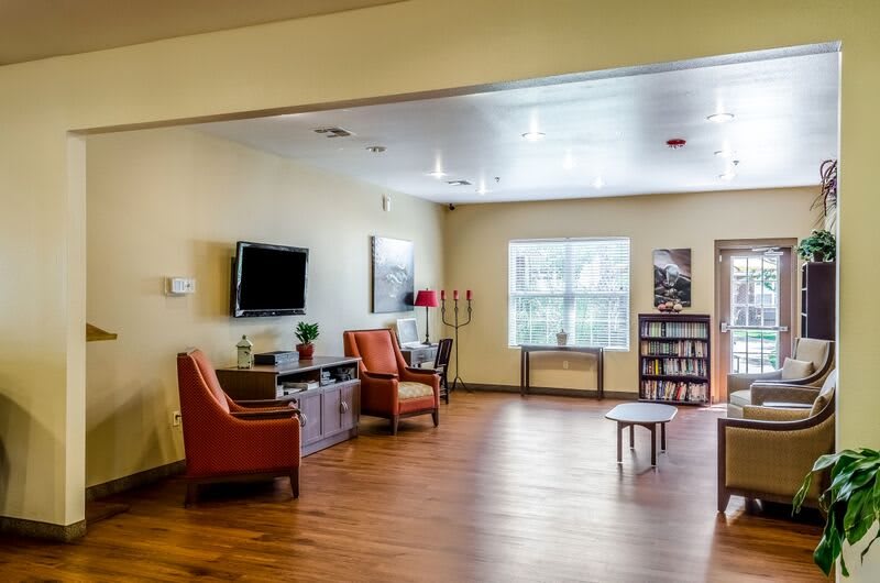 A cozy living room with comfortable seating and a TV.