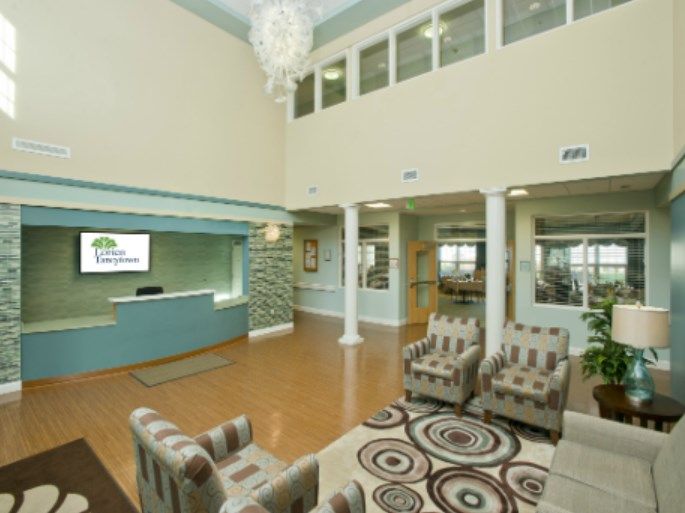 A modern lobby with comfortable seating and a reception desk.