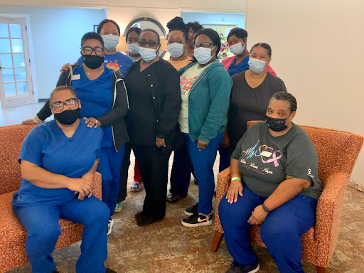 A dedicated team of healthcare workers coming together, showcasing their commitment and teamwork.