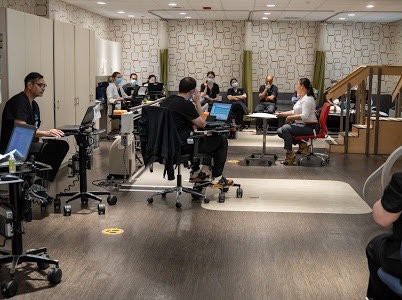 A group of people engaged in a meeting in a modern office space.