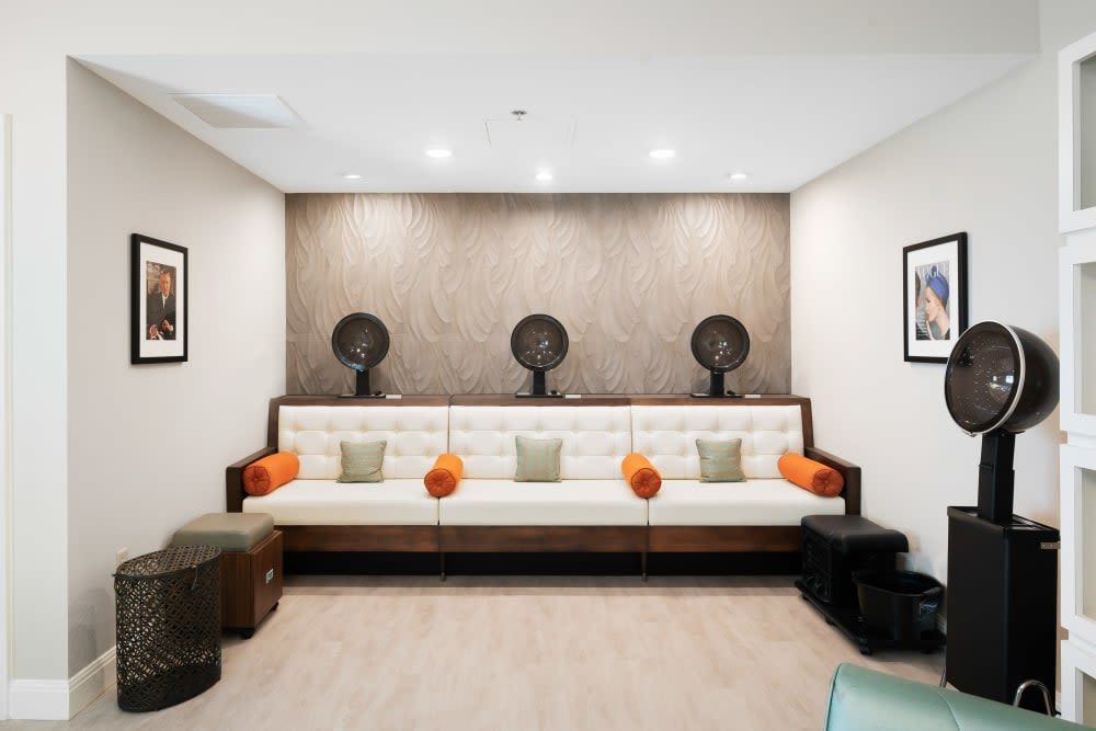 A modern waiting area with stylish seating and decorative accents.