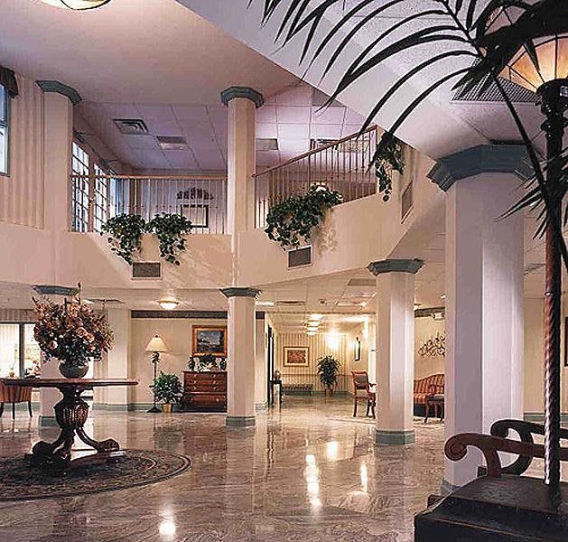A luxurious hotel lobby with elegant columns and tasteful decor.