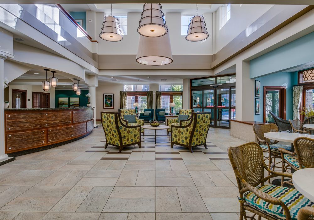A modern hotel lobby featuring comfortable seating and elegant lighting.