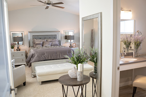 A stylish and modern bedroom featuring elegant furnishings and a serene ambiance.