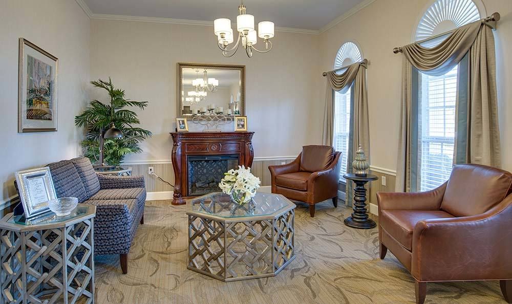 Elegant living room with a cozy fireplace and stylish furniture.