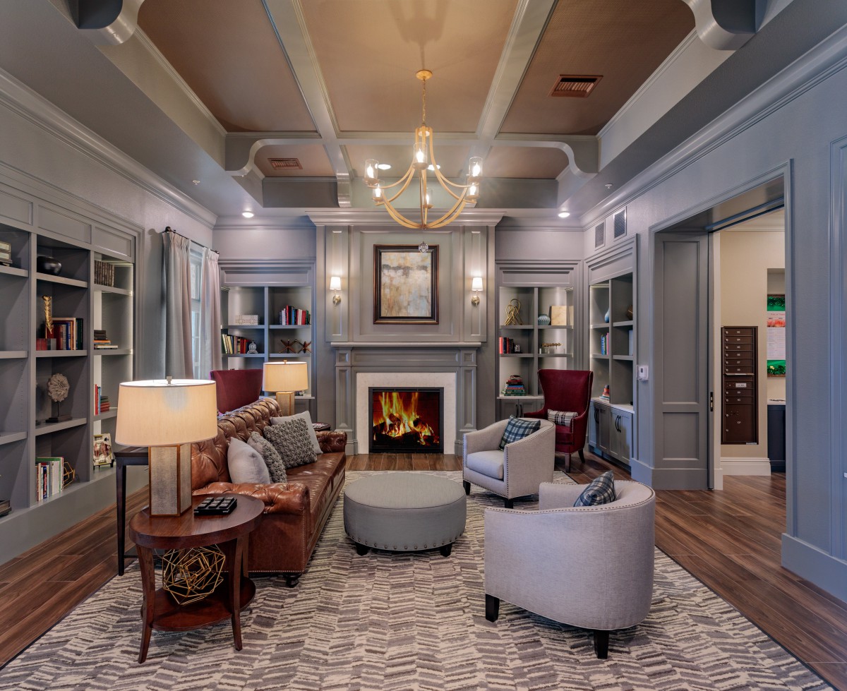 A stylish living room featuring a cozy fireplace and elegant furnishings.