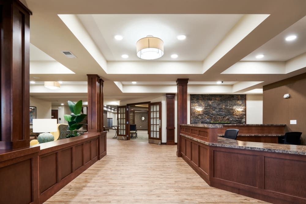 A modern lobby with wood paneling and elegant lighting.