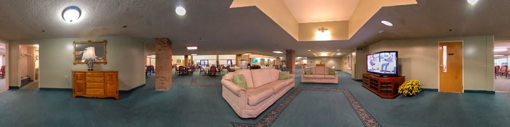 A spacious lobby area featuring comfortable sofas and stylish interior decor.