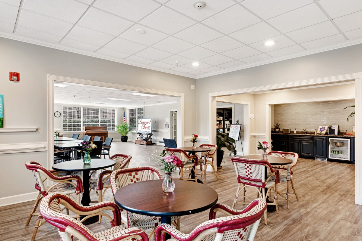 A cozy cafe interior with tables and chairs arranged for guests.