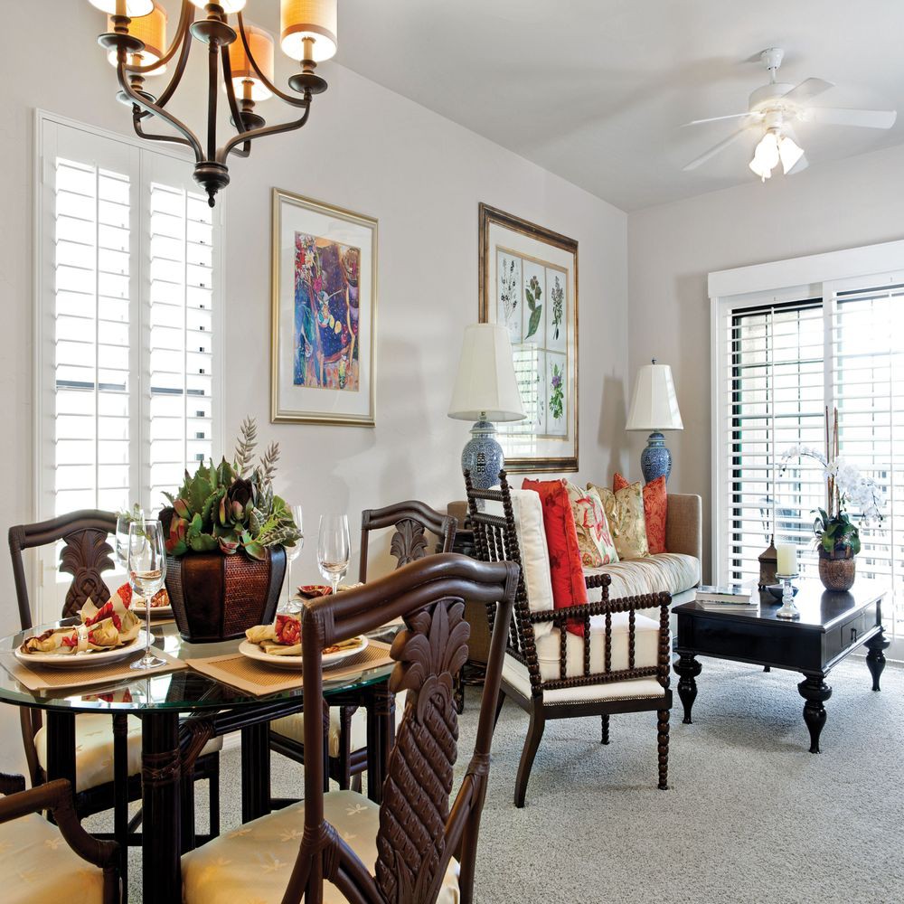 A cozy dining and living area with elegant furnishings and tasteful decor.