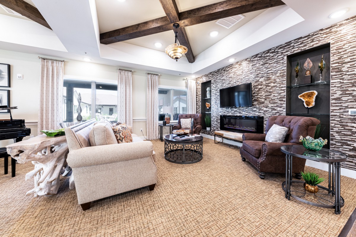 A cozy living room with comfortable seating and a modern rustic design.