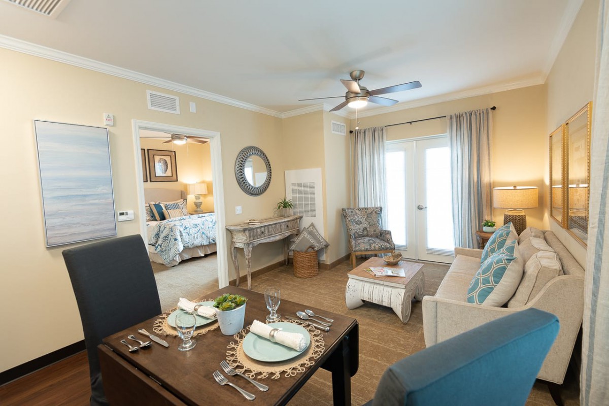 A cozy living and dining area with modern furnishings and a warm ambiance.