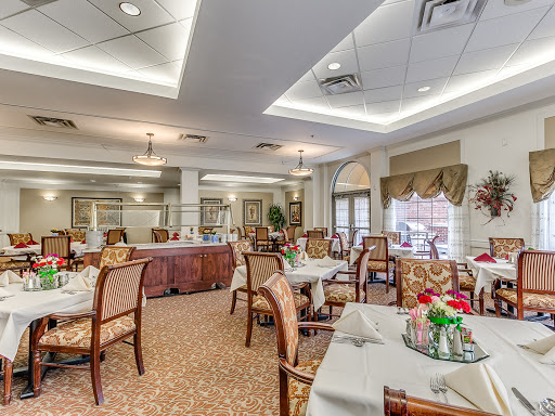 A beautifully designed dining area featuring elegant tables and chairs, ideal for fine dining.