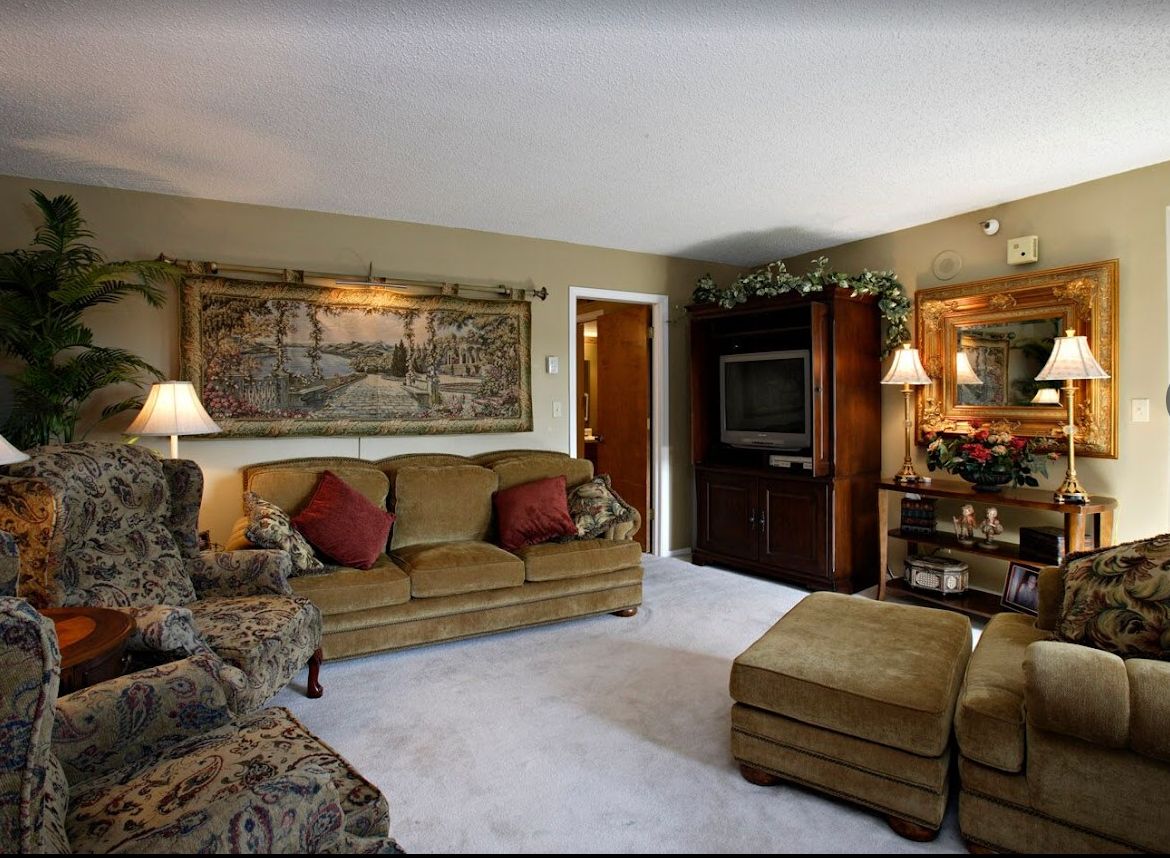 A cozy living room with comfortable seating and warm decor.