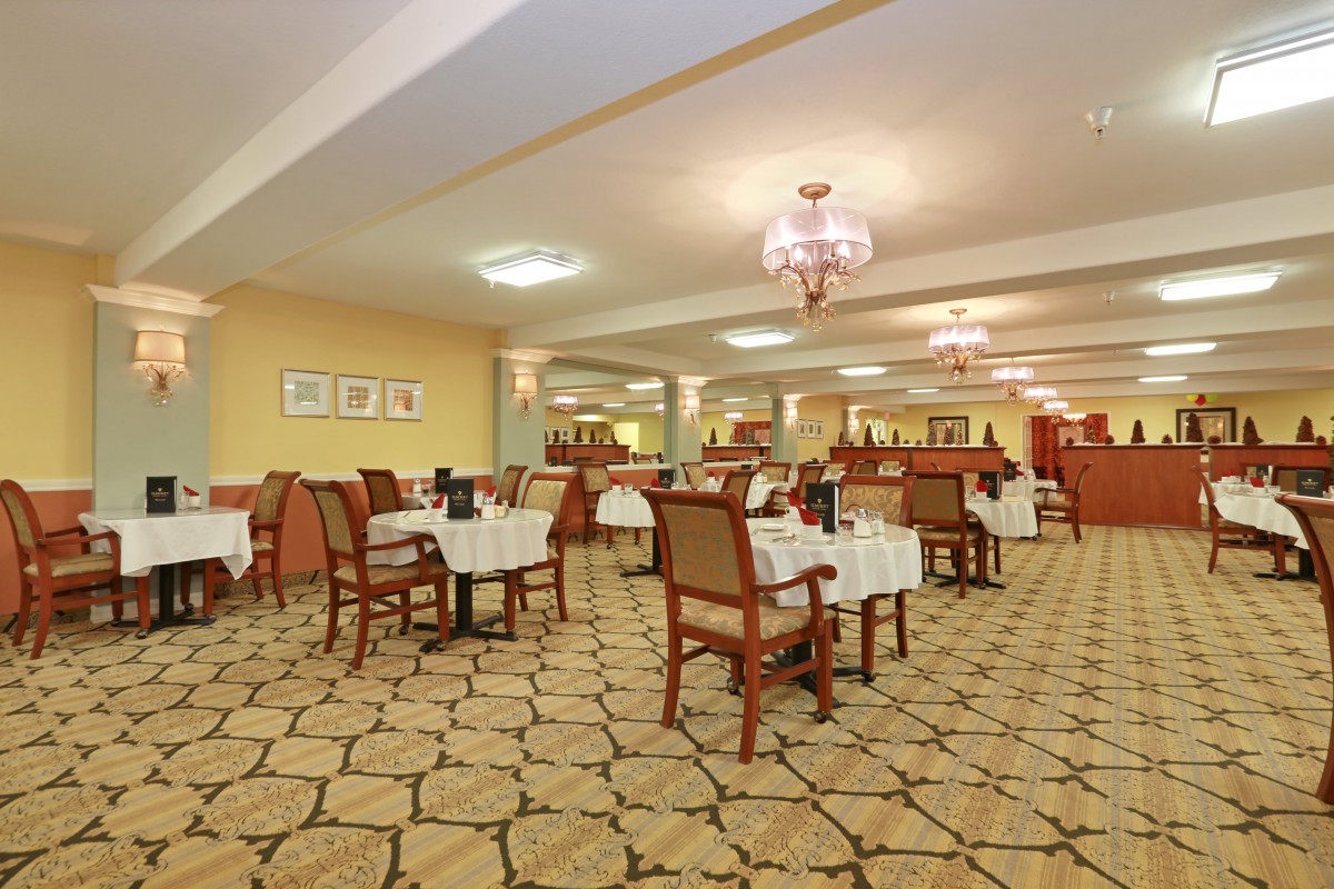 An elegant restaurant dining area with neatly arranged tables and chairs.