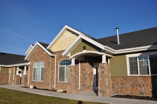 A modern residential house showcasing a blend of brick and siding.