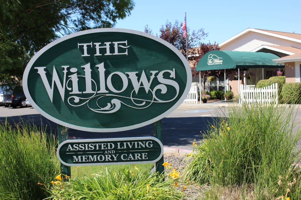 Entrance sign for The Willows Assisted Living and Memory Care facility.