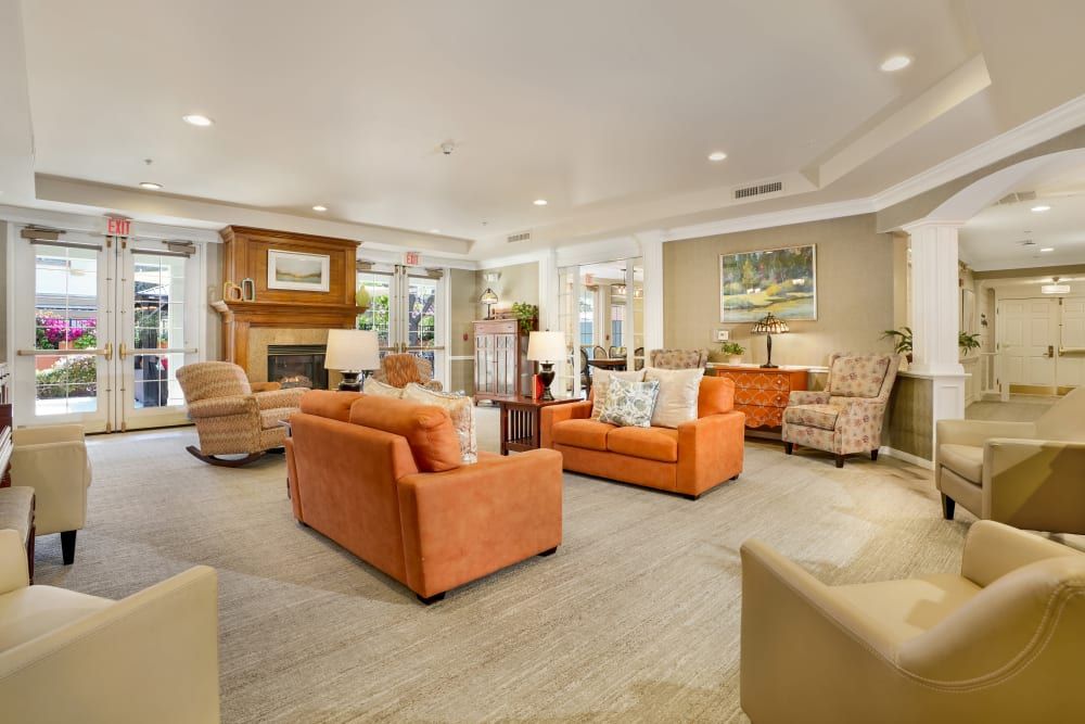 A cozy living room with comfortable seating and a fireplace.