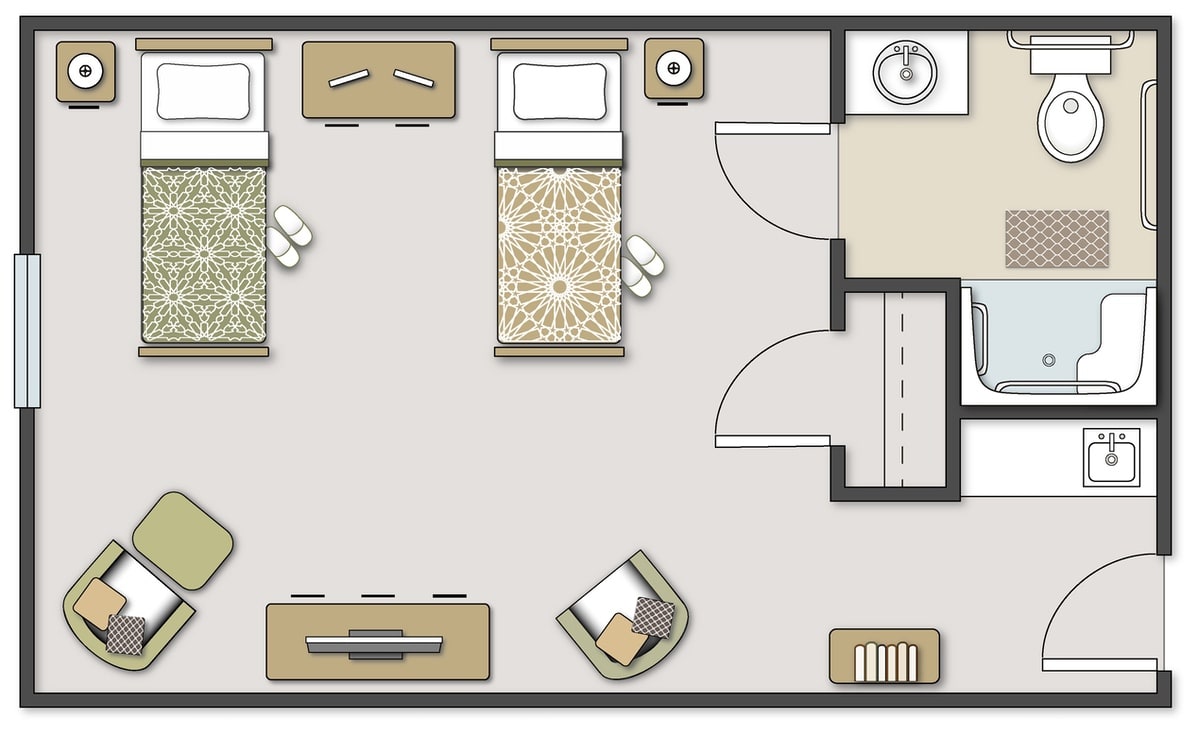 A floor plan of a bedroom with twin beds and arranged furniture.
