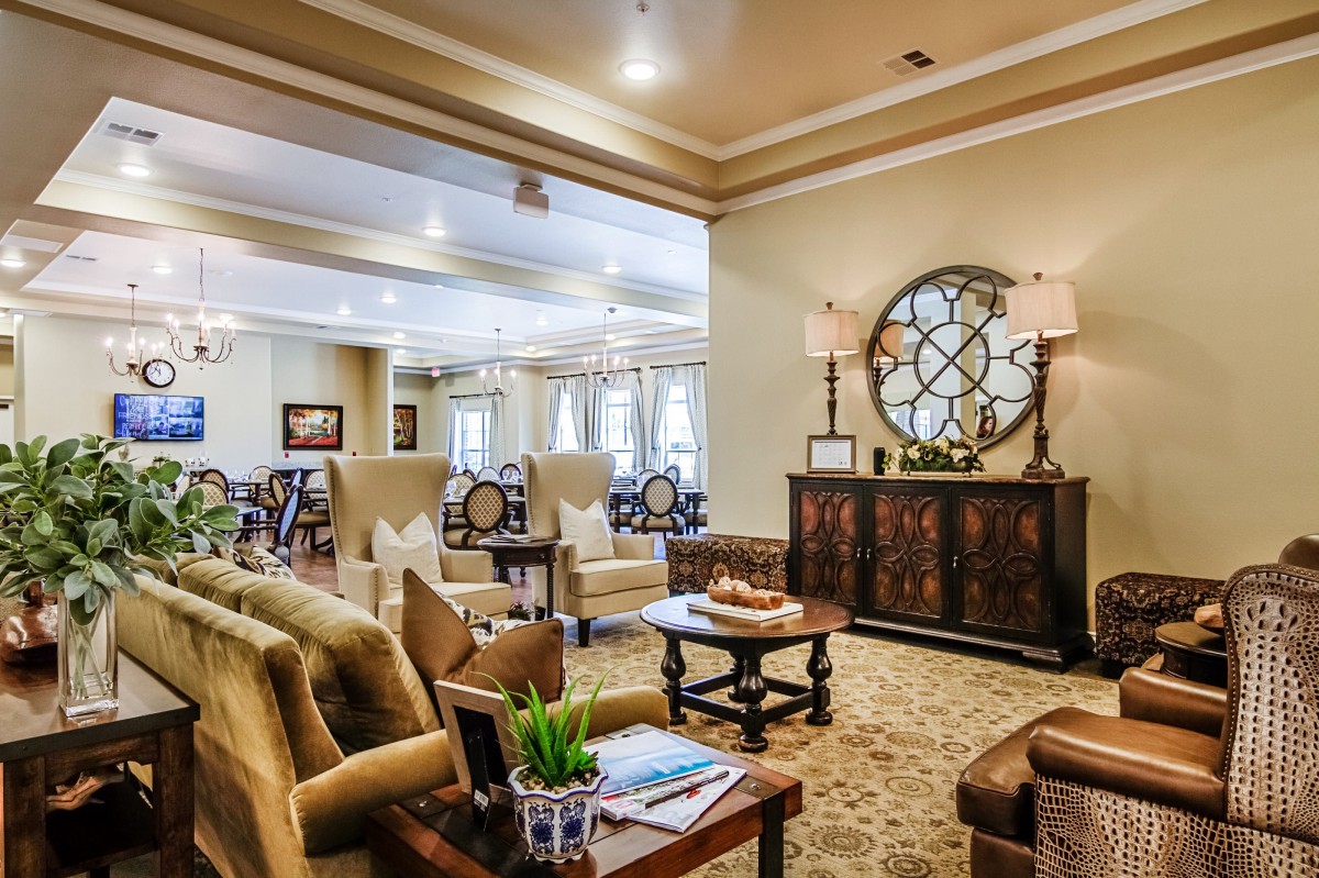 A cozy and elegantly decorated living room with comfortable seating and stylish decor.