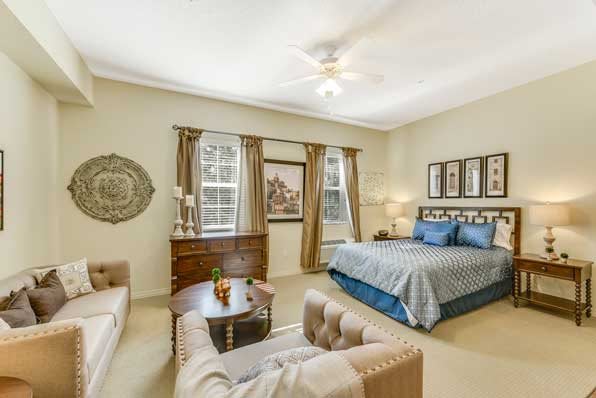 A well-decorated bedroom with elegant furnishings and tasteful artwork.