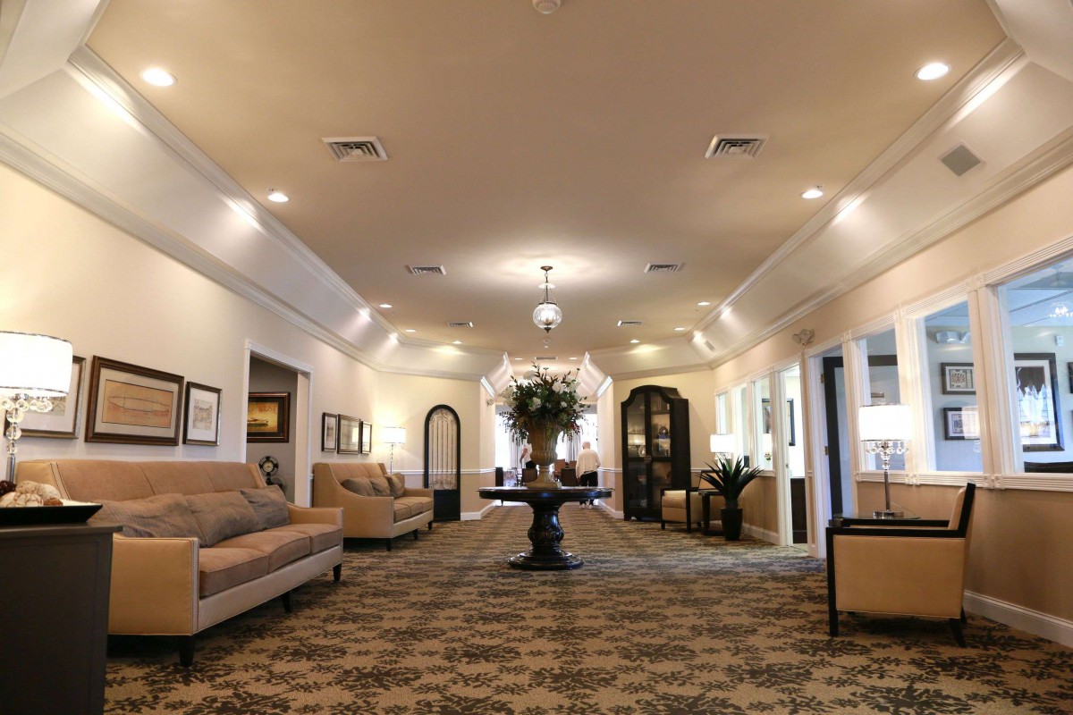 A spacious, elegantly decorated lobby featuring comfortable sofas and ambient lighting.