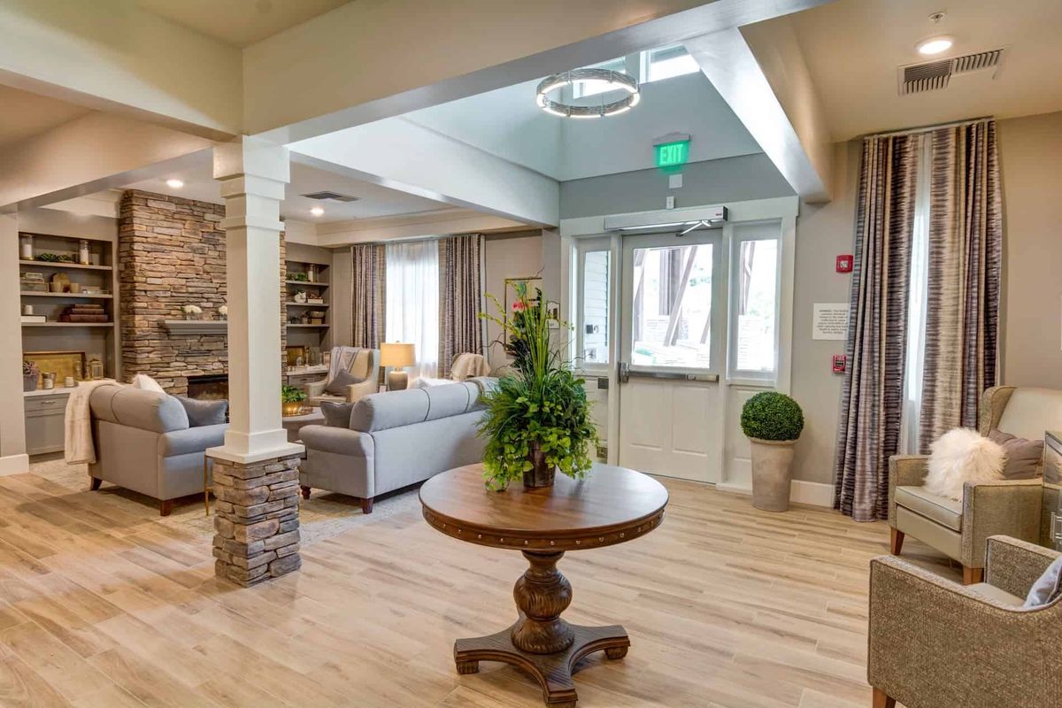 A modern living room with comfortable seating and elegant decor.