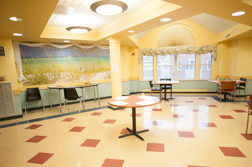 A bright and inviting dining area with yellow walls and modern furnishings.