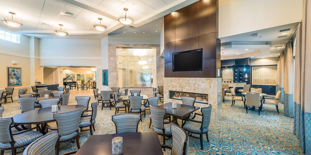 A modern restaurant dining area with tables and chairs arranged neatly, featuring contemporary lighting and dcor.
