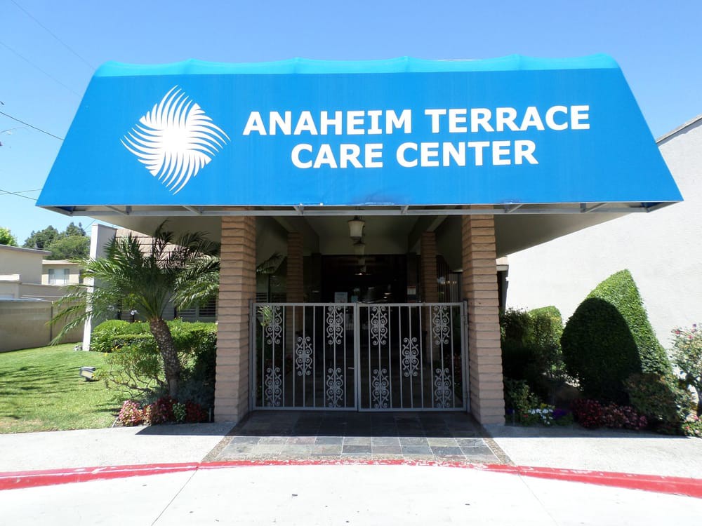 Entrance of Anaheim Terrace Care Center with a blue awning.
