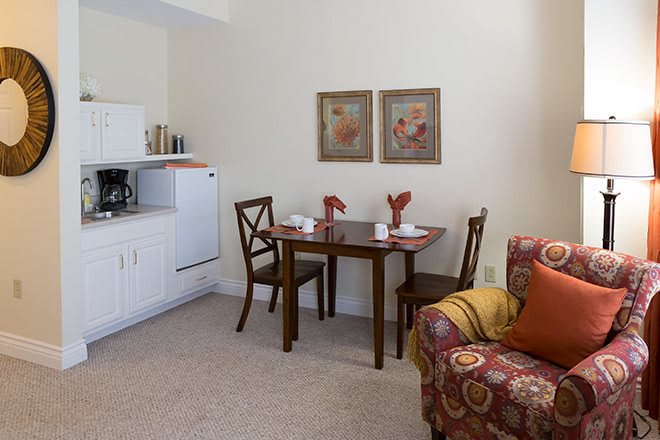 Cozy living space with a small dining area and kitchenette.