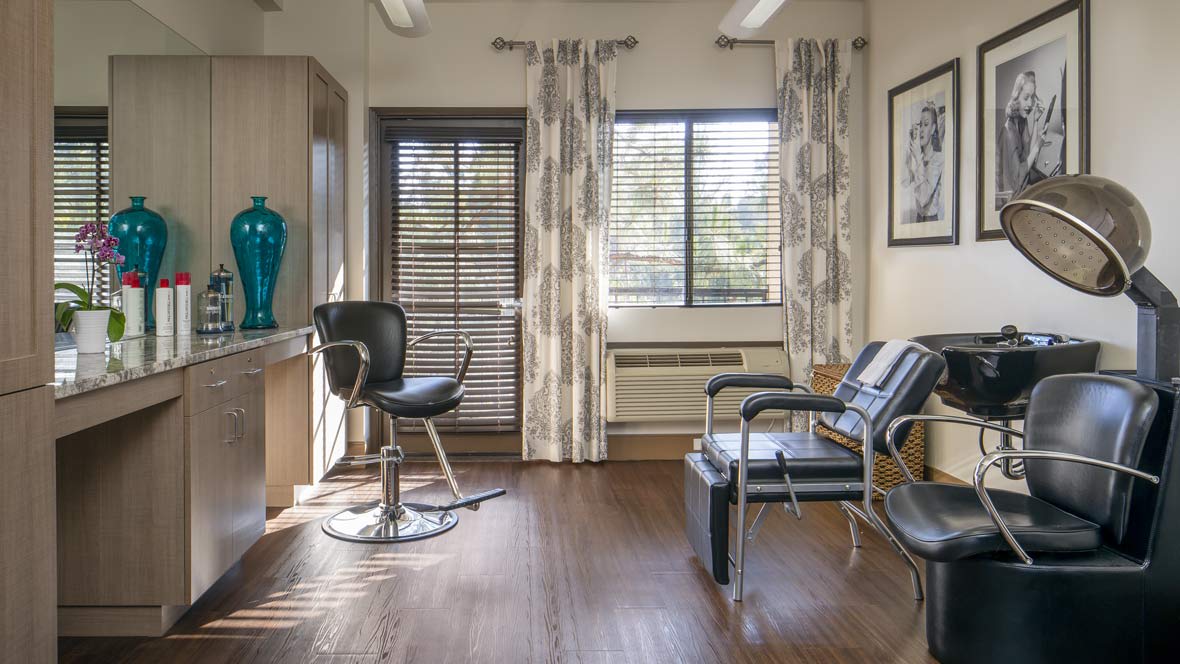 A well-lit salon interior with chairs and modern decor.