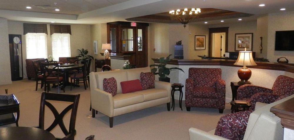 A cozy living room with stylish furniture and warm lighting.