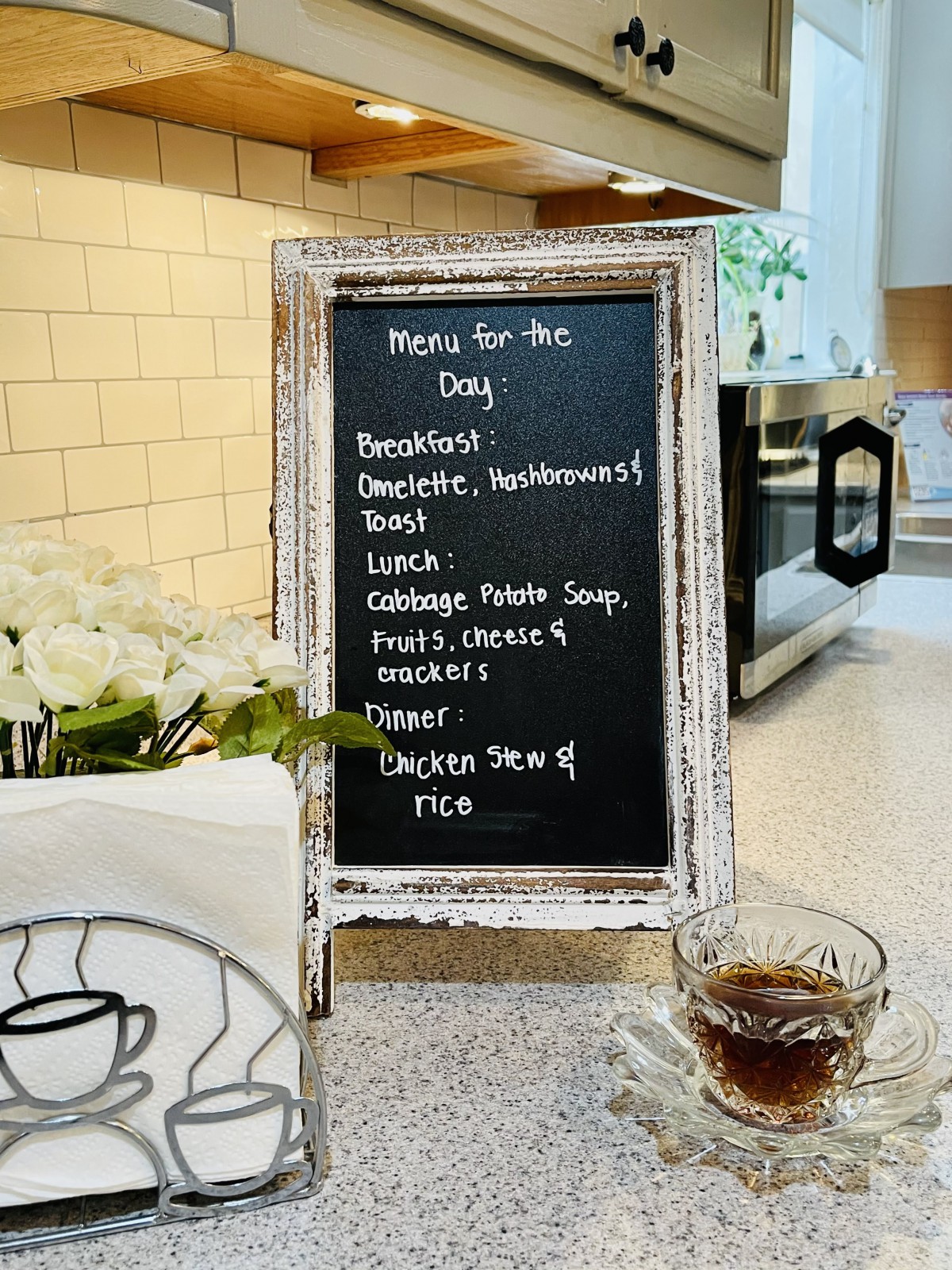 A chalkboard menu displaying the day's meals and drinks in a cozy cafe setting.