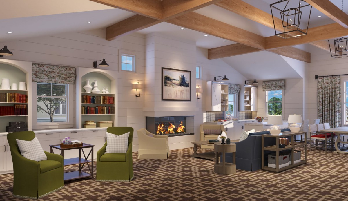 A cozy living room with modern decor featuring a fireplace, comfortable furniture, and wooden beams.