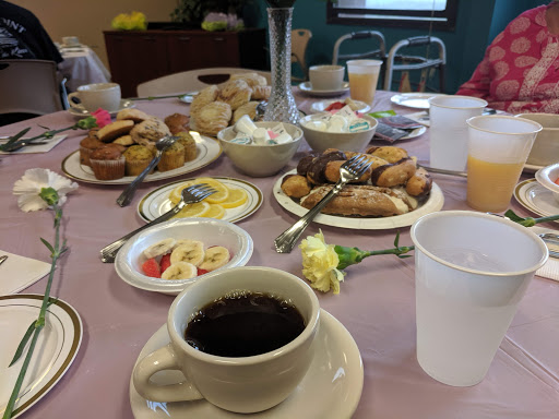 A cozy breakfast table filled with an array of delicious foods and beverages.