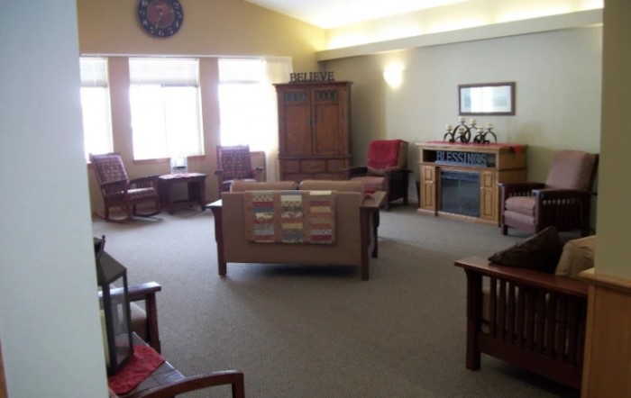 A cozy living room featuring comfortable seating and a fireplace.